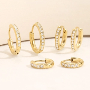 Detailed set of three sizes gold-plated hoop earrings with cubic zirconia inlay