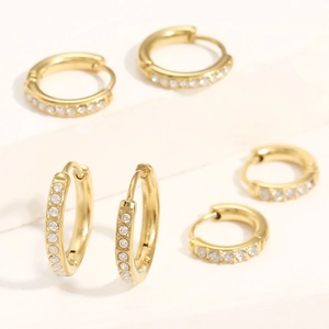 Close-up of gold stainless steel hoop earrings with sparkling cubic zirconia inlay