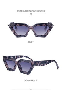 Detail view of tortoiseshell geometric cat eye sunglasses with double gray lenses