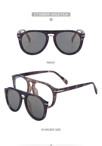 Vue détaillée de lunettes magnétiques ambre avec rivets dorés et verres gris amovibles