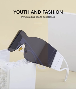 Detail of white wide-arm rimless Y2K cycling sunglasses with gray wind-guiding lens