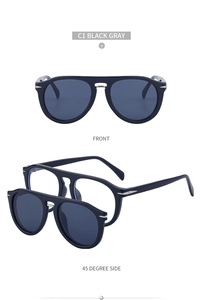 Détail de lunettes de soleil clipsables noir mat avec accent métallique et verres gris foncé