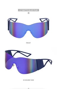 Detail view of C7 matte blue film rimless Y2K sports sunglasses with cutout geometric temples
