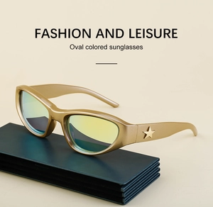 Detail of gold oval frame sunglasses with yellow-green gradient lenses and star decor