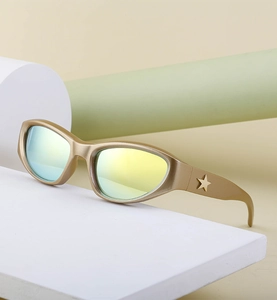 Detailed view of Y2K cat-eye sunglasses with star temple detail and mirrored lenses
