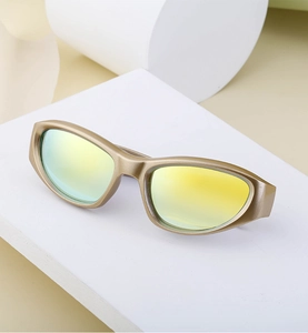 Detail of matte champagne gold Y2K sports sunglasses with colorful reflective lenses