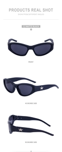 Detail view of matte black Y2K cat-eye sunglasses with silver star metal ornaments