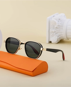Polarized oval sunglasses with gold metal trim and a luxury orange leather case