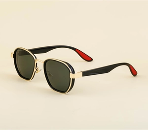 Detail view of vintage polarized sunglasses featuring black frames and gold metal accents