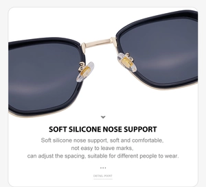 Detail of adjustable soft silicone nose pads and gold metal bridge on black sunglasses