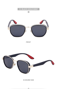 Detail view of oval polarized sunglasses in black and gold frame with grey lenses