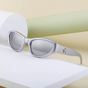 Silver Y2K sports sunglasses with star detail and grey lenses on display stand