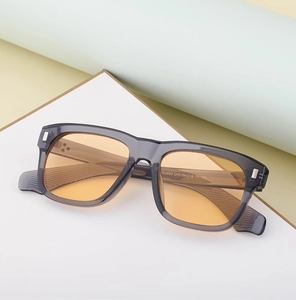 Detail shot of ZN3663 square sunglasses with translucent grey frame and orange tinted lenses
