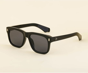 Detail view of black square sunglasses with silver accents and metal rivet decorations