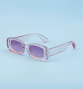 Detail view of pink frame sunglasses showing gradient purple lenses and temple hinges