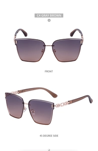 Detailed front and side view of oversized gradient sunglasses with gold chain temples
