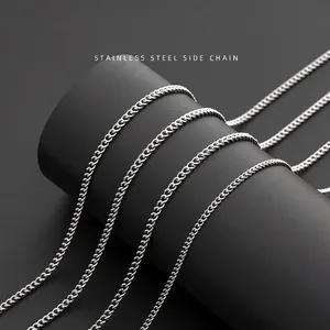 Polished silver stainless steel side chain necklace wrapped on black cylinder