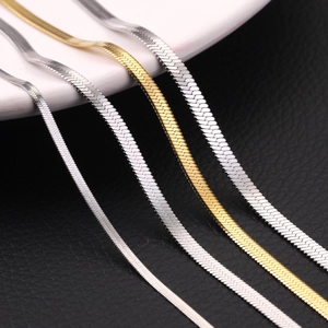 Sleek gold and silver herringbone chains in minimalist stainless steel styles
