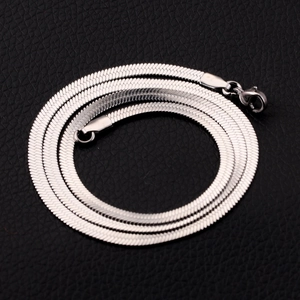 Flat silver stainless steel snake chain with lobster clasp for jewelry making on black leather