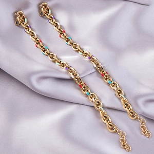 Macro view of colorful enamel link bracelet in gold-plated stainless steel with lobster clasp