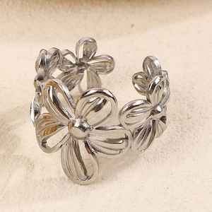 Close-up of a silver-toned cutout flower open ring with delicate daisy petal details