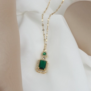 Elegant 18K gold-plated emerald-cut green zircon pendant necklace on luxury display