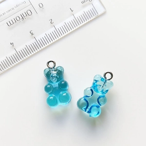 Detailed view of blue gradient resin bear charms with size measurement for DIY jewelry