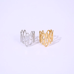 Detailed view of hollow irregular wave rings in gold and silver finishes