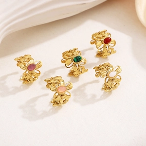 Detailed set of five gold vintage hollow flower rings with oval natural stone inlays