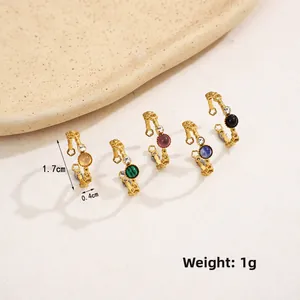 Close-up of five colorful hollow flower earrings with rhinestones and crystals