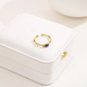 French style gold ring with blue stone and zirconia on a beaded adjustable band
