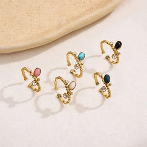Detailed set of five gold stainless steel rings with colorful oval stones and zircons