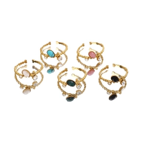 Five gold stainless steel rings with colorful oval natural stones and beaded bands