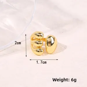Detail shot of a golden geometric ocean ring with dimensions 2cm width and 6g weight