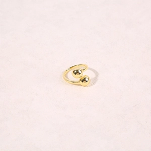 Detailed view of a gold-plated open ring featuring a minimalist double bead design