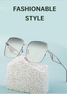 Detail of silver metal frame and gradient lenses on oversized square sunglasses