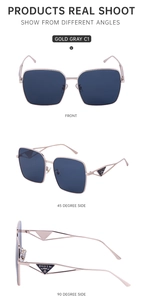 Detail view of large square sunglasses with gold metal frame and triangle temple design