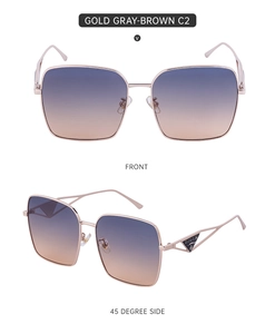 Detail view of large square metal sunglasses with gradient lenses and hollow triangle temple