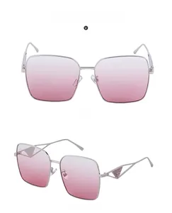 Macro detail of oversized silver frame sunglasses with pink gradient lenses and side view