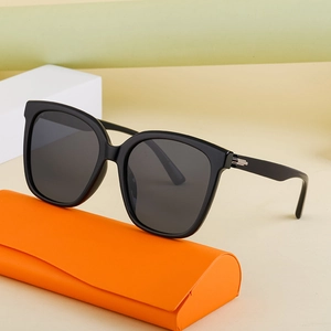 Classic black square polarized sunglasses with a stylish orange leather foldable case