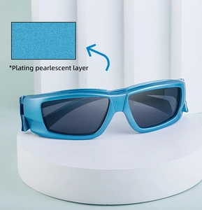 Detail of Y2K sports sunglasses featuring a pearl blue plated frame and dark gray lenses