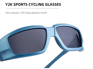 Detail of metallic blue Y2K cycling glasses frame with dark grey tinted lenses