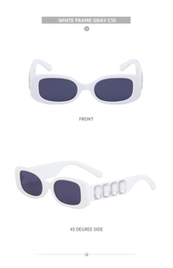 Détail de lunettes de soleil carrées blanches avec branches ornées de cristaux et verres gris