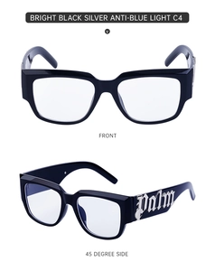 Vue détaillée des lunettes œil-de-chat noires avec logo Palm en métal sur branches larges