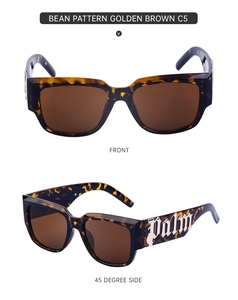 Détails de lunettes de soleil écailles avec branches larges et lettrage Palm doré