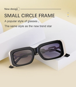 Close-up of rectangular frame sunglasses with silver metal edges and purple gradient lenses