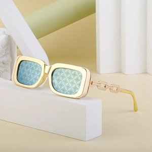Retro rectangular sunglasses with gold chain temples and star pattern lenses on stones
