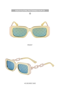 Close-up of gold rectangle sunglasses with chain temples and patterned lenses