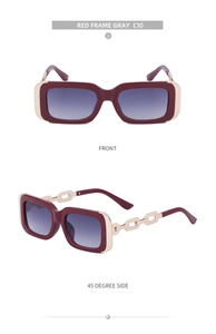 Detail of red square sunglasses with luxury gold chain temples and gradient lenses