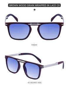 Detail view of foldable brown wood grain sunglasses with blue gradient lenses and metal hinges